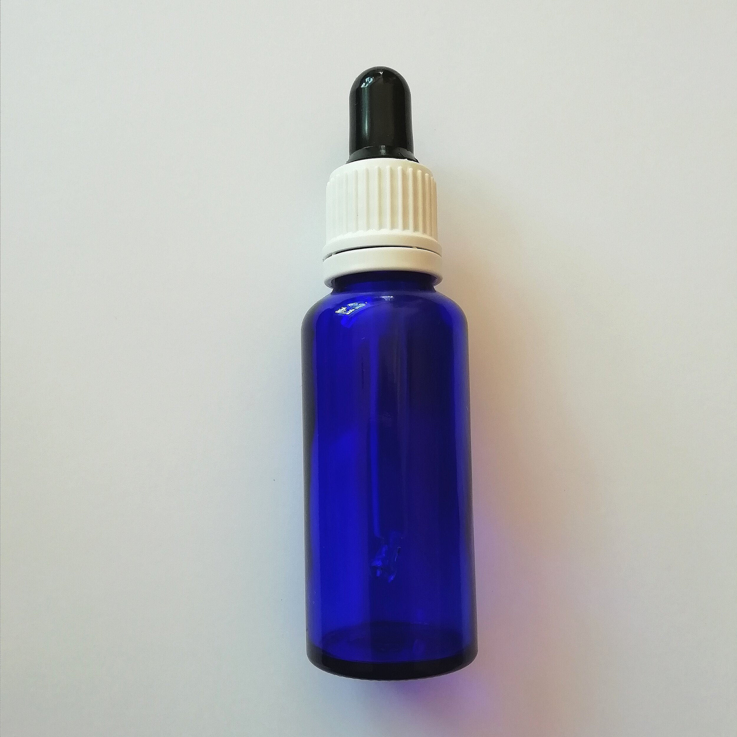 Empty 30ml blue dropper bottle with tamperproof lid