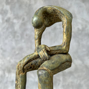 Medium Patinated Bronze Hollow Man Sculpture on stand