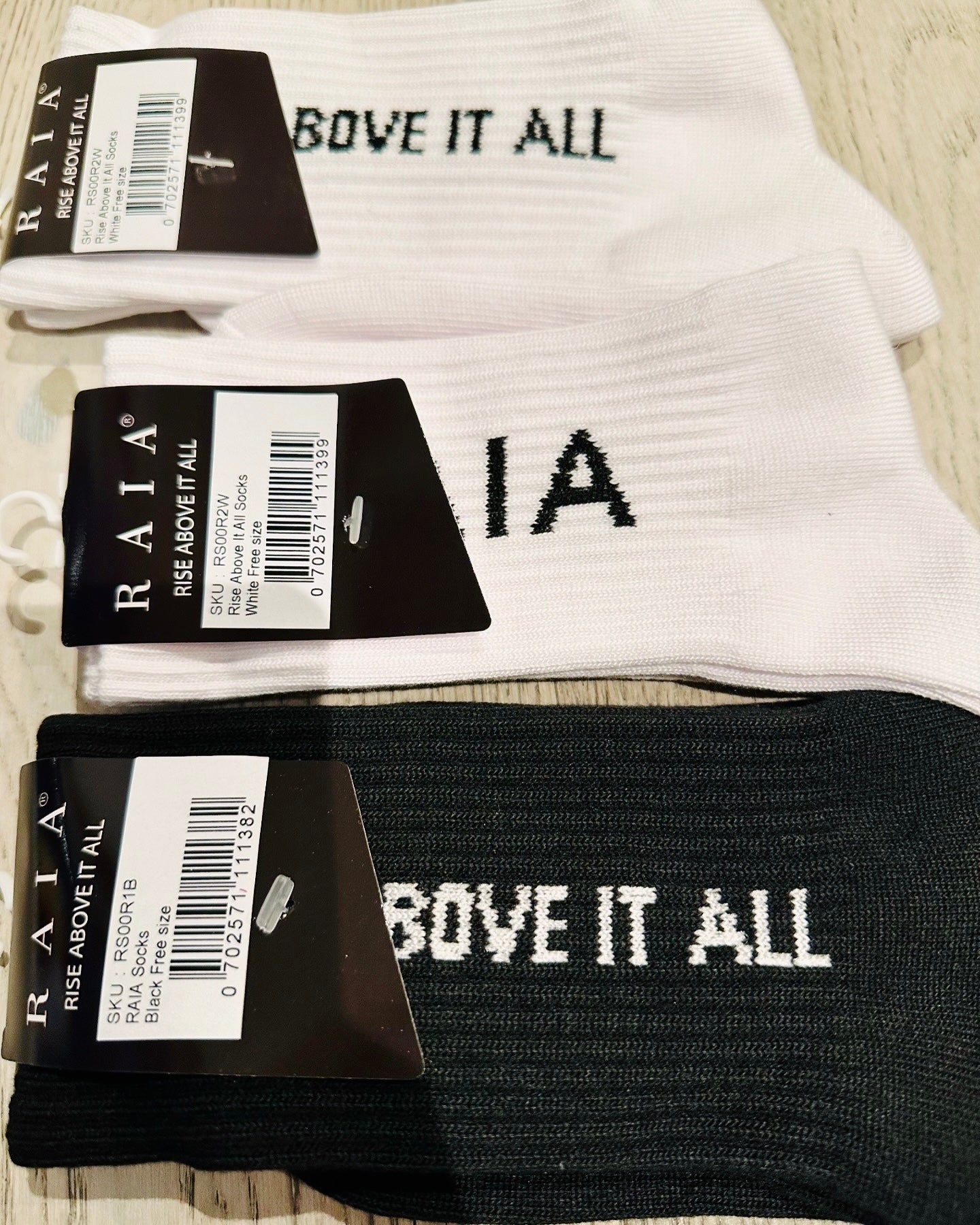 “Rise Above It All” Logo Socks - White