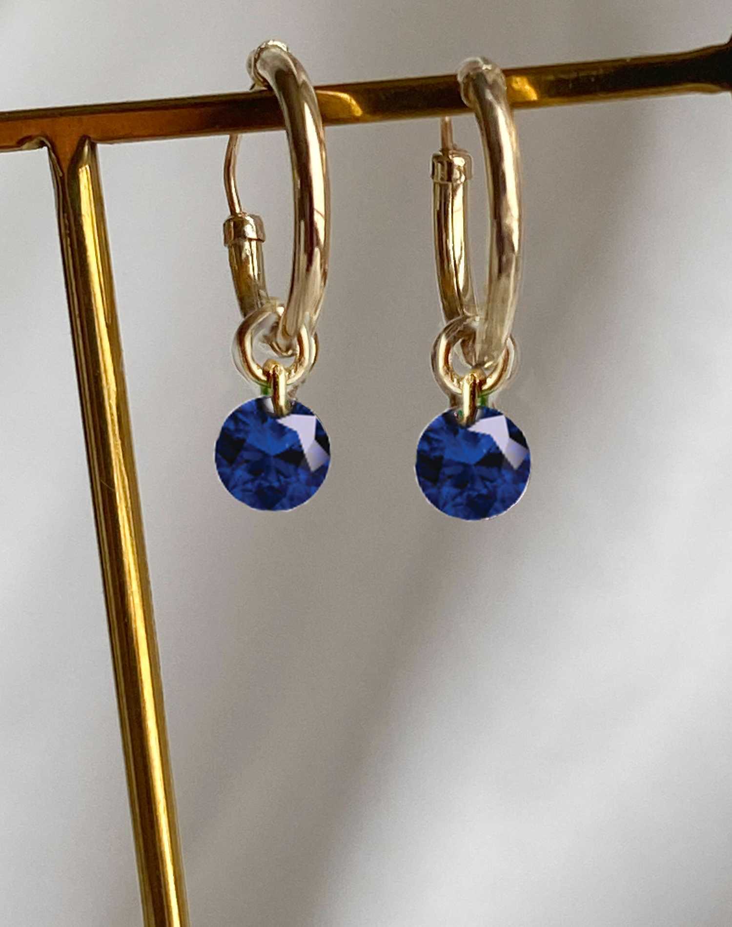 Rising Star Blue Sapphire Huggie Hoops