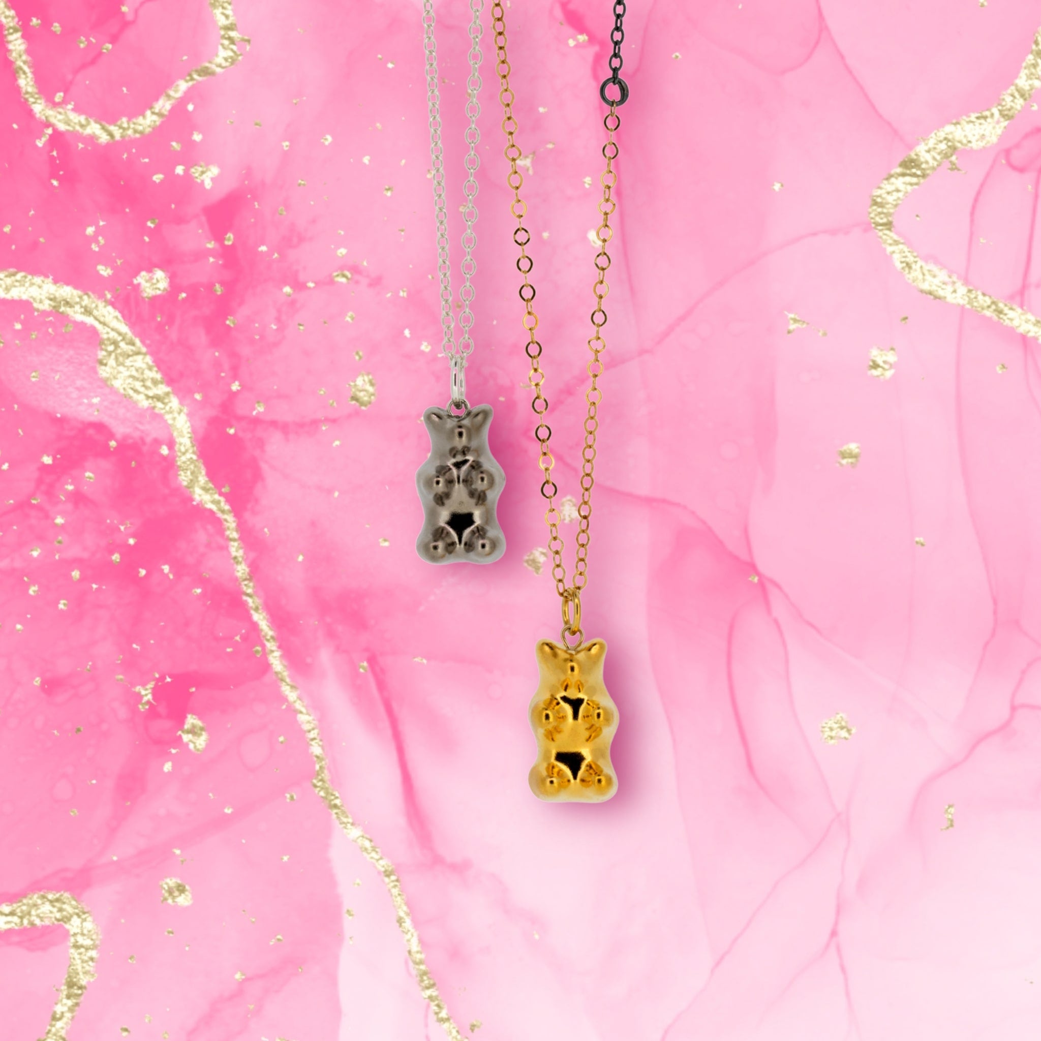gold_and_silver_gummy_bear_necklaces_pink_background-min.jpg