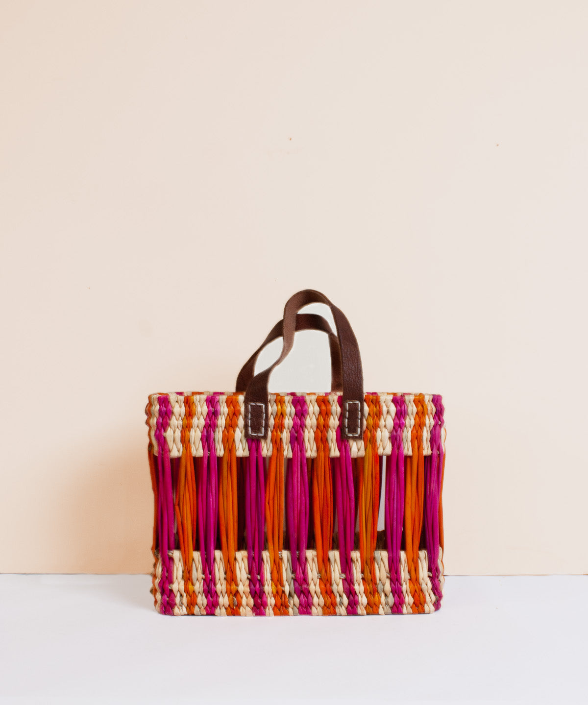 Decorative-Reed-Basket-Orangeandpink-Bohemiadesign-front.jpg