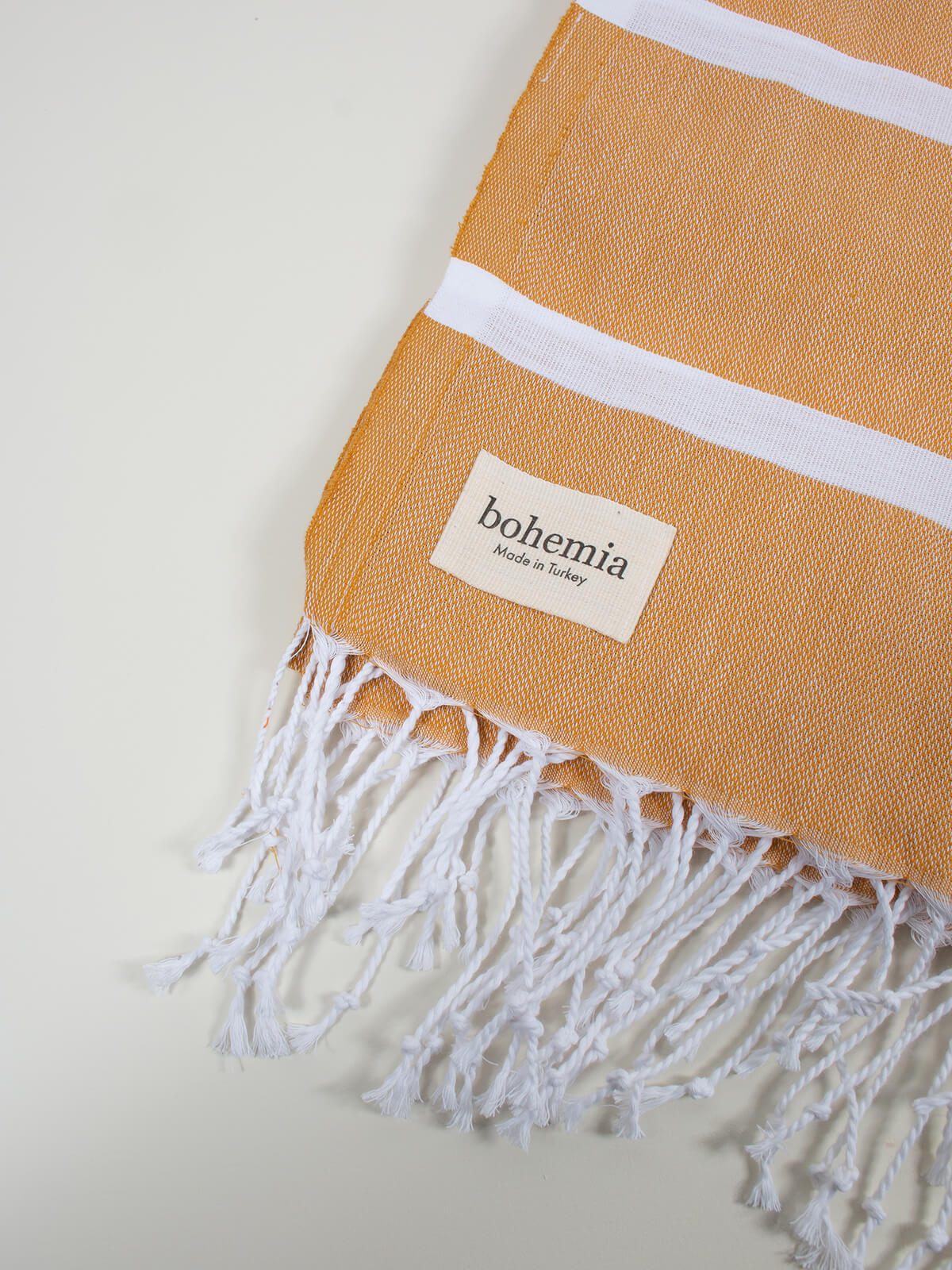 bohemia-design-ibiza-summer-hammam-towel-tassle-mustard.jpg